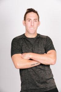 Greg headshot arms crossed